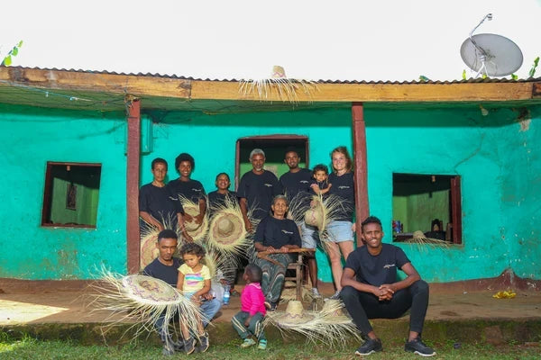 The Bette Buna team and family gathered outside the original farmhouse at Taferi Kela, Sidama